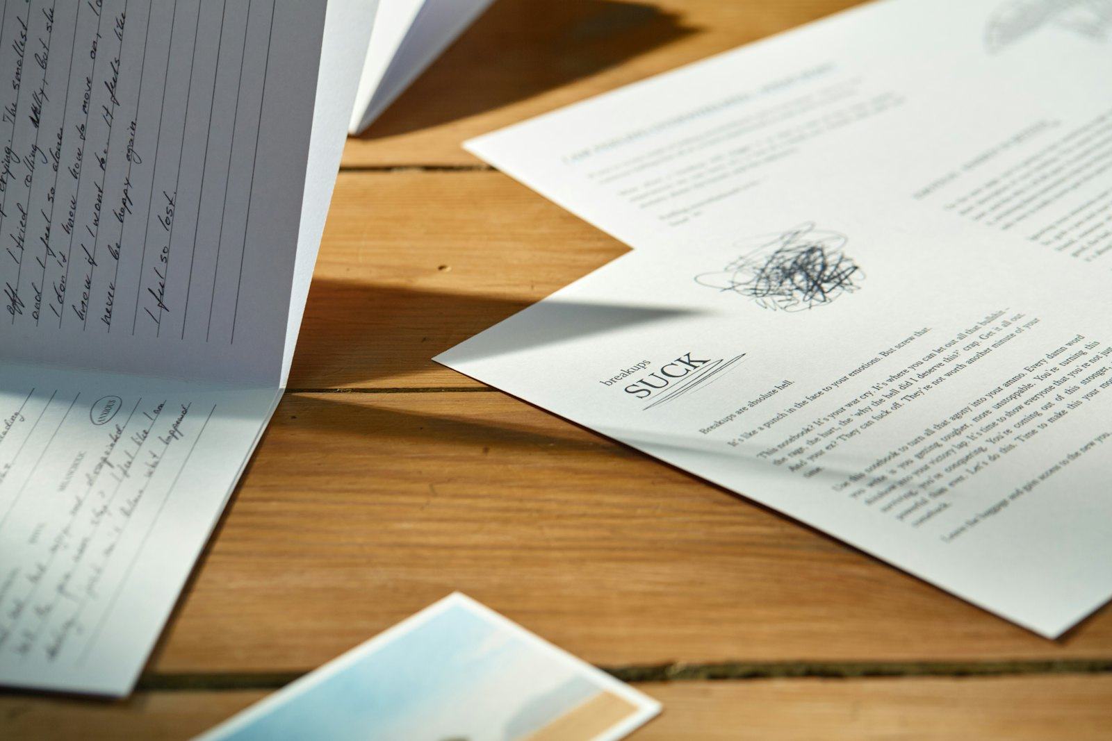 Legal paperwork and figures laid out on a desk